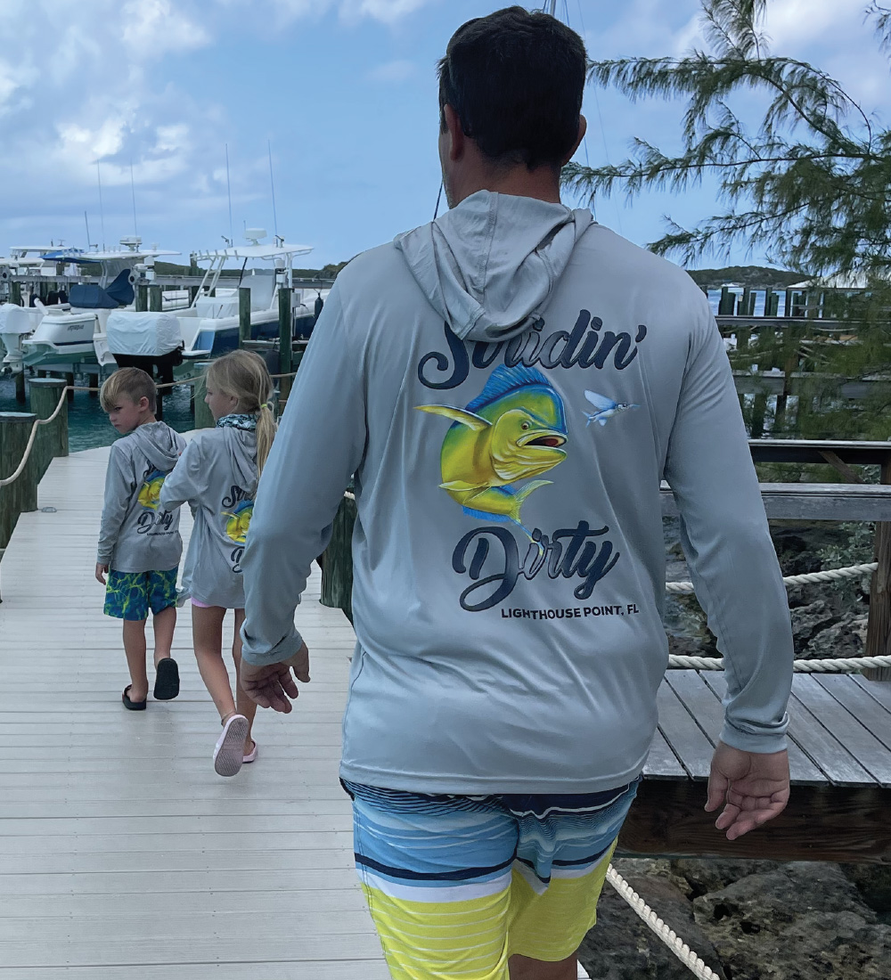 Printed apparel shown on a dock near boats